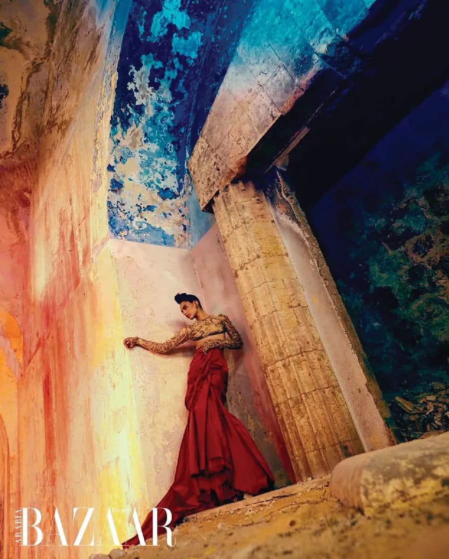 Harper's Bazaar Arabia editorial with a model in a red draped gown